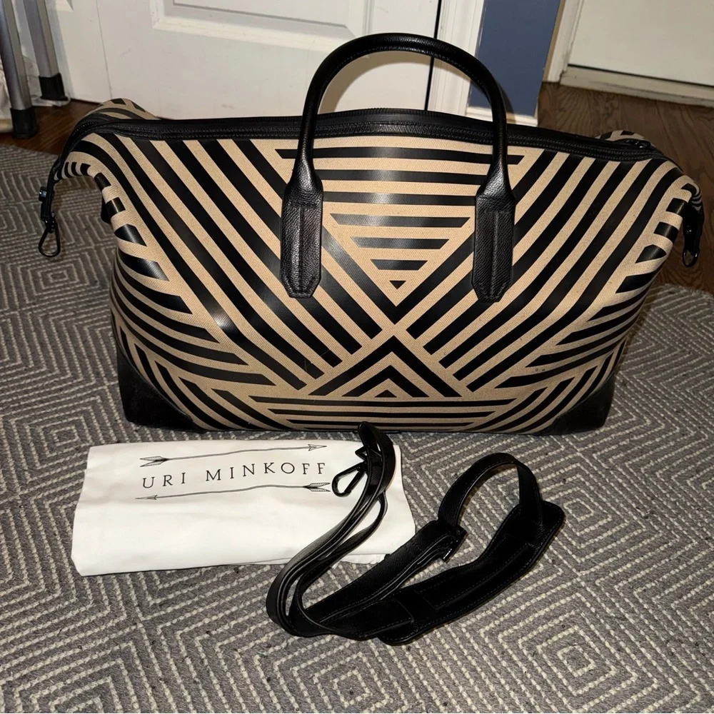 Uri Minkoff tan and black leather geometric design travel bag